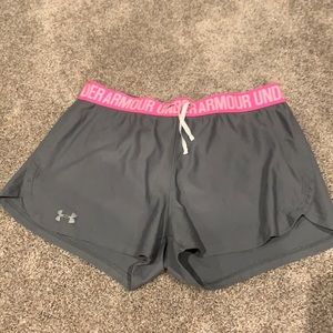 Gray and pink Under Armour athletic shorts.